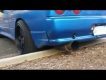 Skyline R32 driver rips exhaust off on gutter