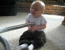Baby can't stop laughing at vacuum!